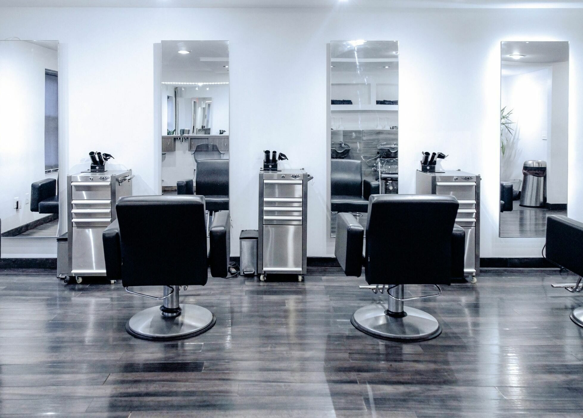 Modern salon chairs and mirrors at H2 Salon Brooklyn, New York, New York, US offering stylish beauty services.