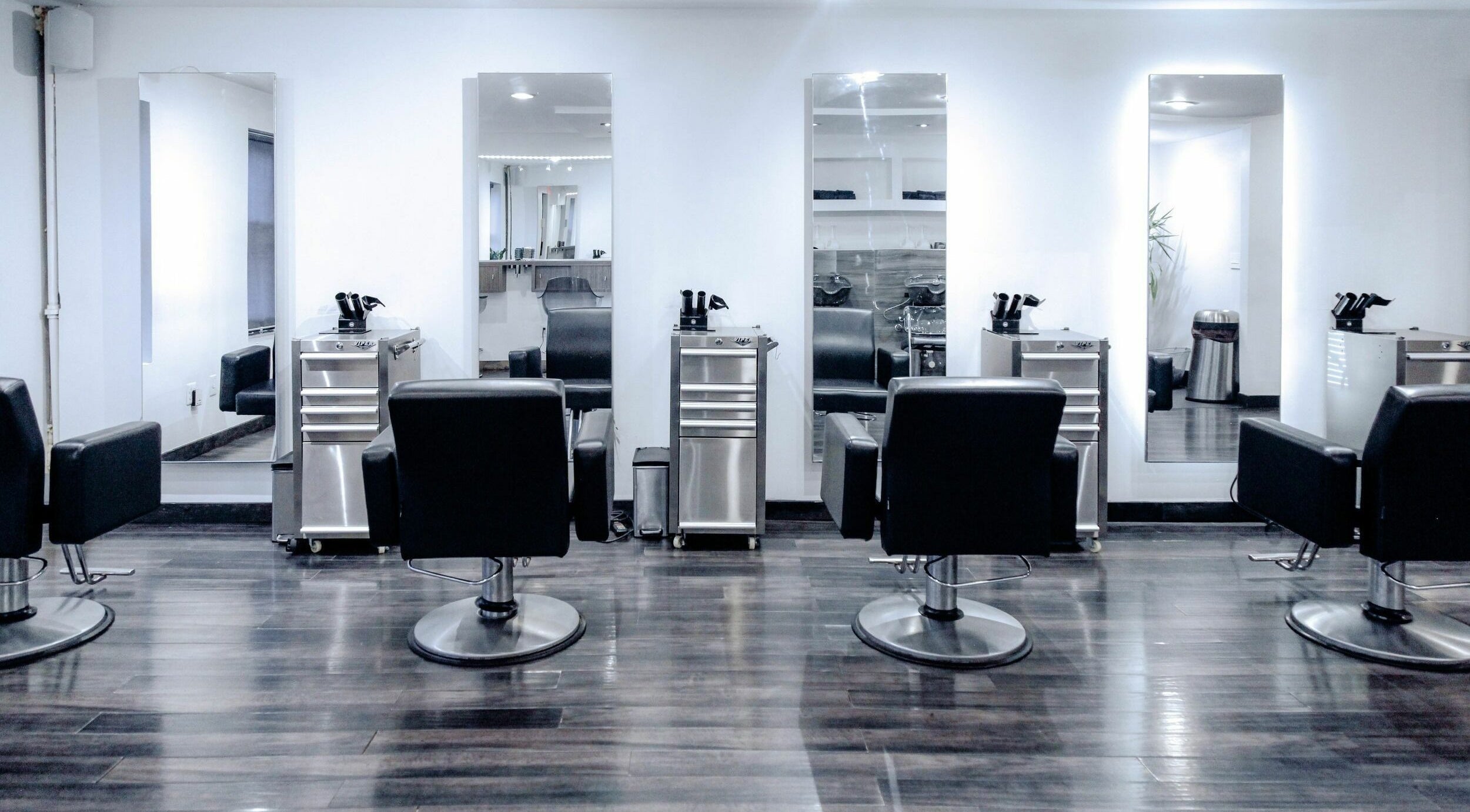 Modern salon chairs and mirrors at H2 Salon Brooklyn, New York, New York, US offering stylish beauty services.