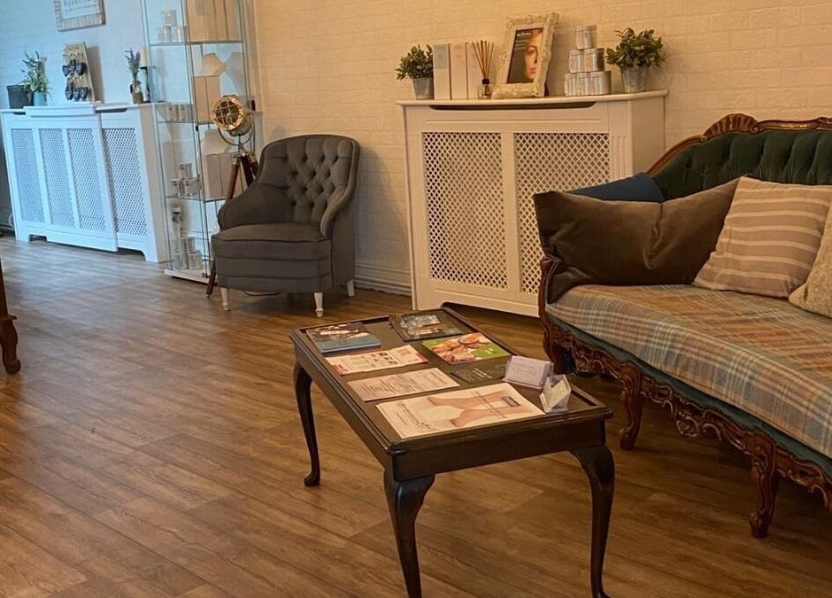 Stylish waiting area at Movement Clinics, Loughborough, England, GB with cozy seats and wooden table.
