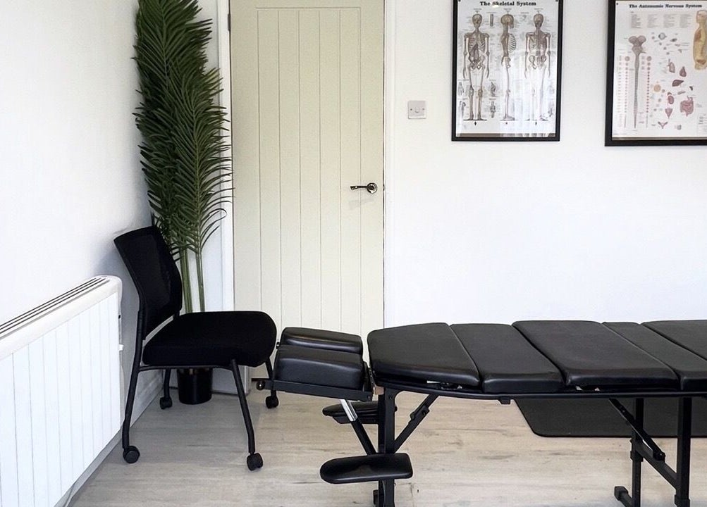 Modern therapy room with sleek adjustment table at Align n' Thryve Chiropractic Clinic, Witchford, England, GB.