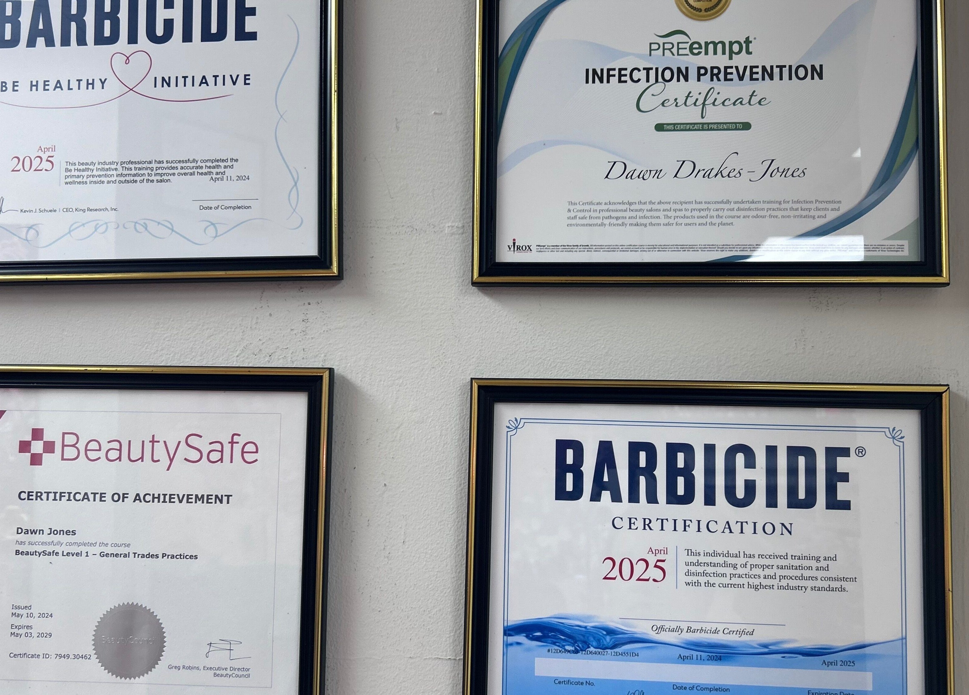 Certification wall at Beauty Girl Studios, Toronto, Ontario, CA showcasing professional qualifications.