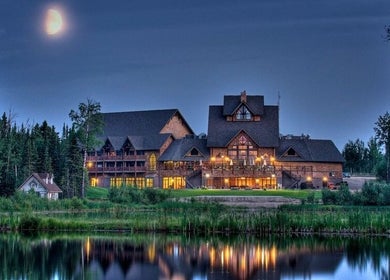 Drift Spa @Elk Ridge in Saskatchewan under a moonlit sky, surrounded by tranquil nature and reflective waters.