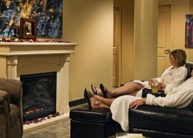 Guests relax by the fireplace at Drift Spa @Elk Ridge, Elk Ridge, Saskatchewan, CA.