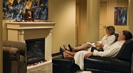 Guests relax by the fireplace at Drift Spa @Elk Ridge, Elk Ridge, Saskatchewan, CA.