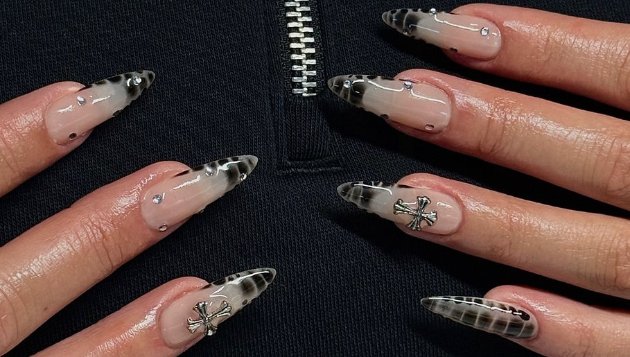 Stylish gothic nail art with black and silver accents at Kallos Nails, Racine, Wisconsin, US.