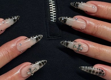 Stylish gothic nail art with black and silver accents at Kallos Nails, Racine, Wisconsin, US.