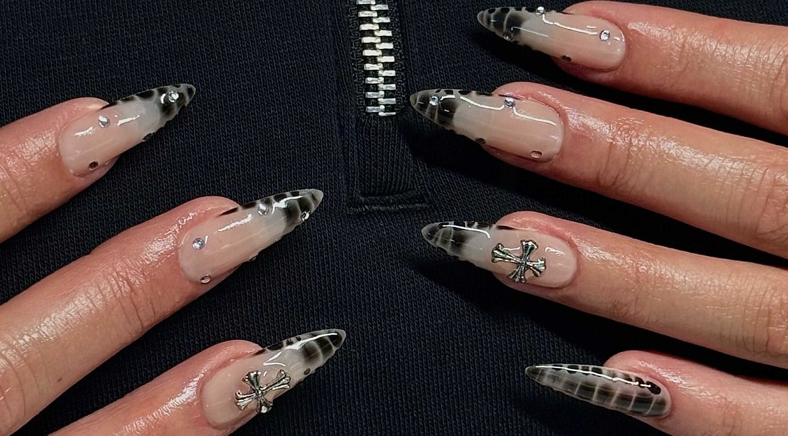 Stylish gothic nail art with black and silver accents at Kallos Nails, Racine, Wisconsin, US.