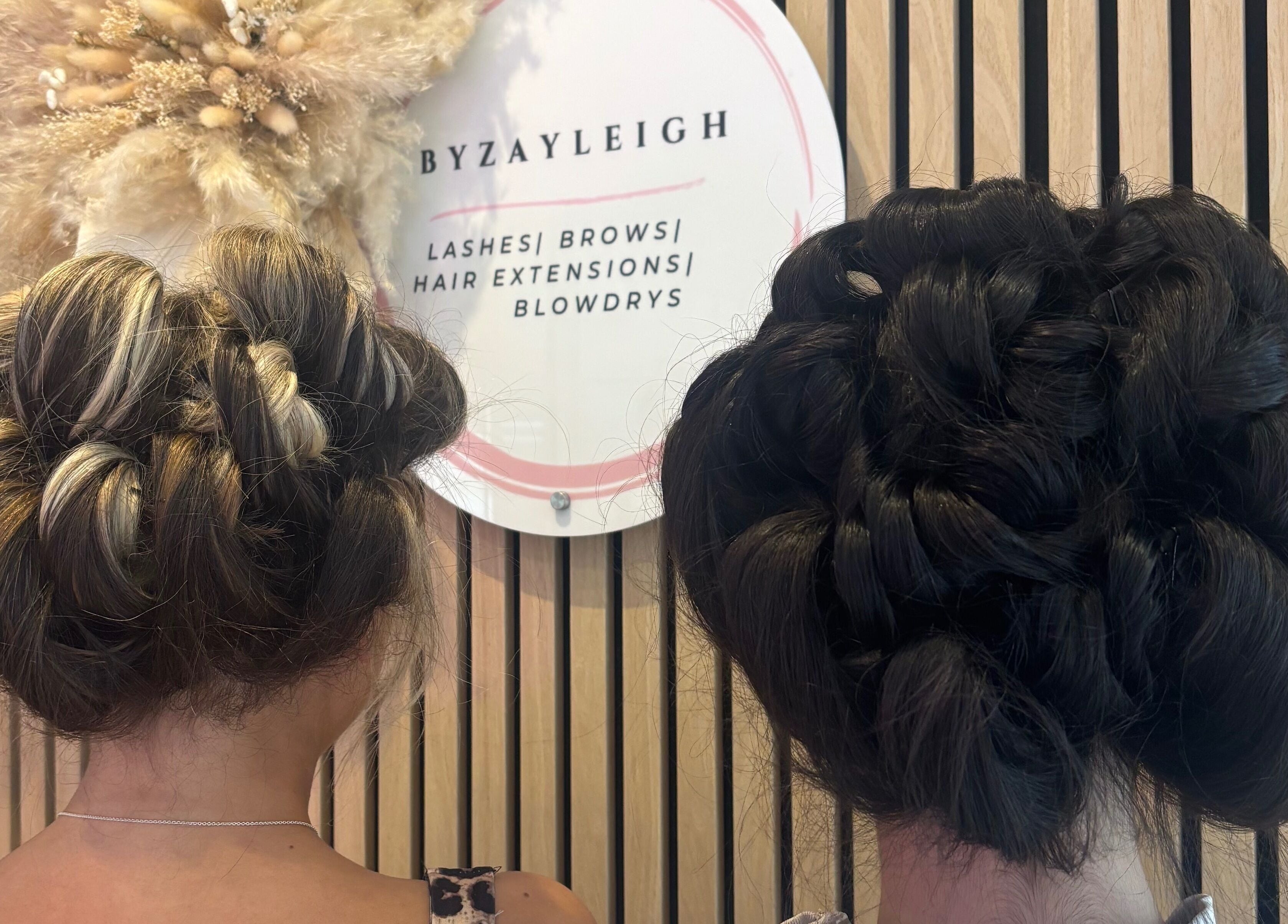 Two elegant braided hairstyles at byzayleigh in Hinckley, England, GB, showcasing expert hair styling.