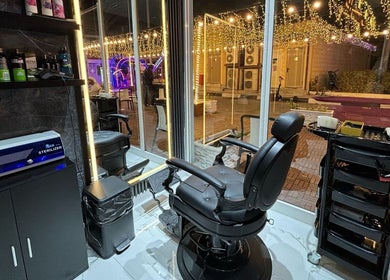 Modern barber chair at YAZ Barbershop - Al Kasir, Abu Dhabi, Abu Dhabi, AE, offering stylish grooming services.