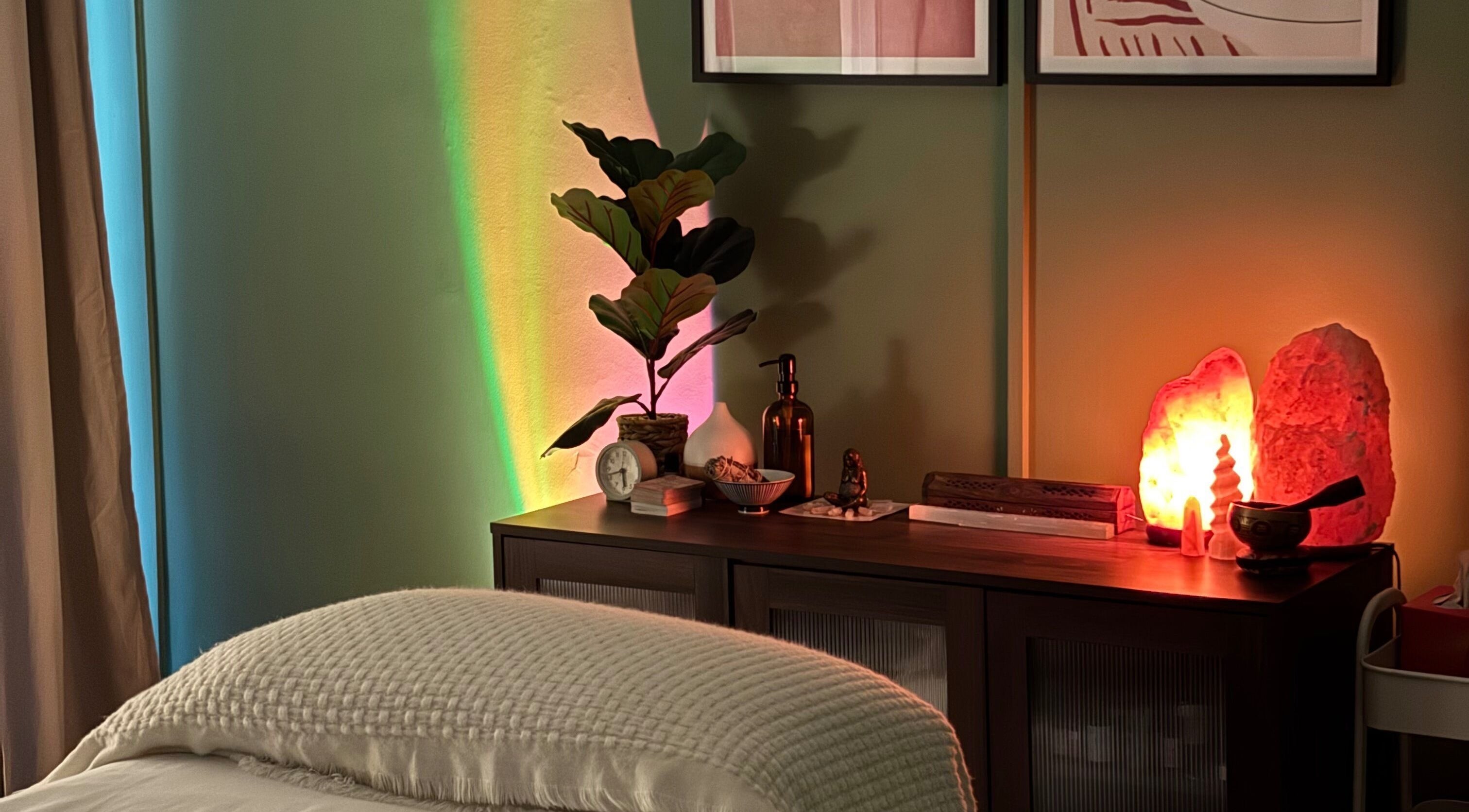 Cozy wellness corner at The Energy Artist, Glasgow, Scotland, GB featuring plants and Himalayan salt lamps.