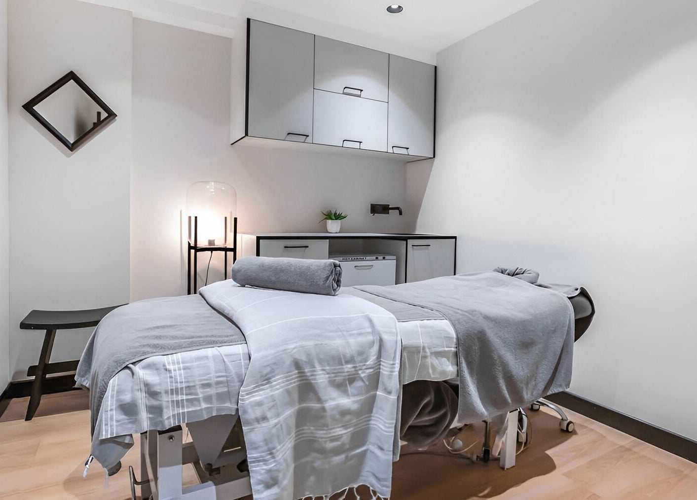 Calm treatment room at Skintopia - Old Bank Arcade, Wellington, NZ, featuring a massage table and soft lighting.