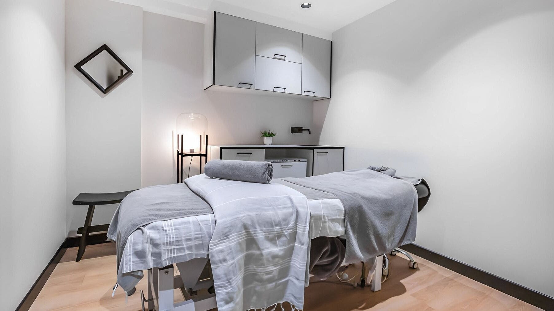 Calm treatment room at Skintopia - Old Bank Arcade, Wellington, NZ, featuring a massage table and soft lighting.