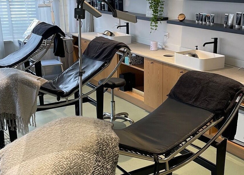 Relaxing treatment room at Skintopia - Khandallah in Wellington, Wellington, NZ with comfortable chairs and serene decor.