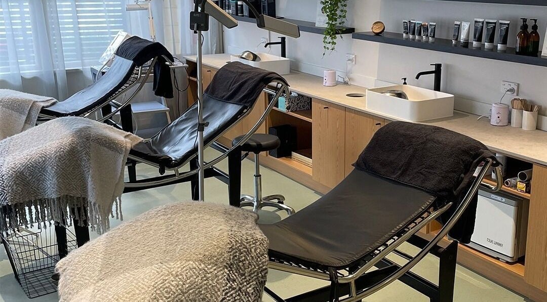 Relaxing treatment room at Skintopia - Khandallah in Wellington, Wellington, NZ with comfortable chairs and serene decor.