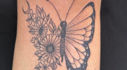Detailed butterfly tattoo with flowers at The Lash & Beauty Lounge by Carlene, Wisbech, England, GB.