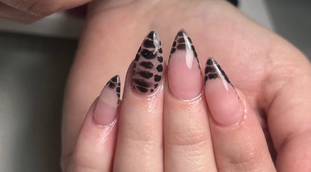 Leopard print nail design at Thebeautyroom, Bulkington, England, GB. Trendy stiletto manicure in stylish black.