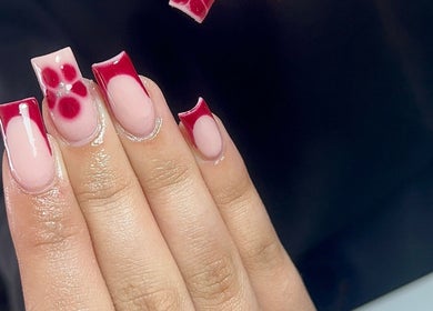 Elegant red nail art at Thebeautyroom, Bulkington, England, GB showcasing glossy chic manicure designs.
