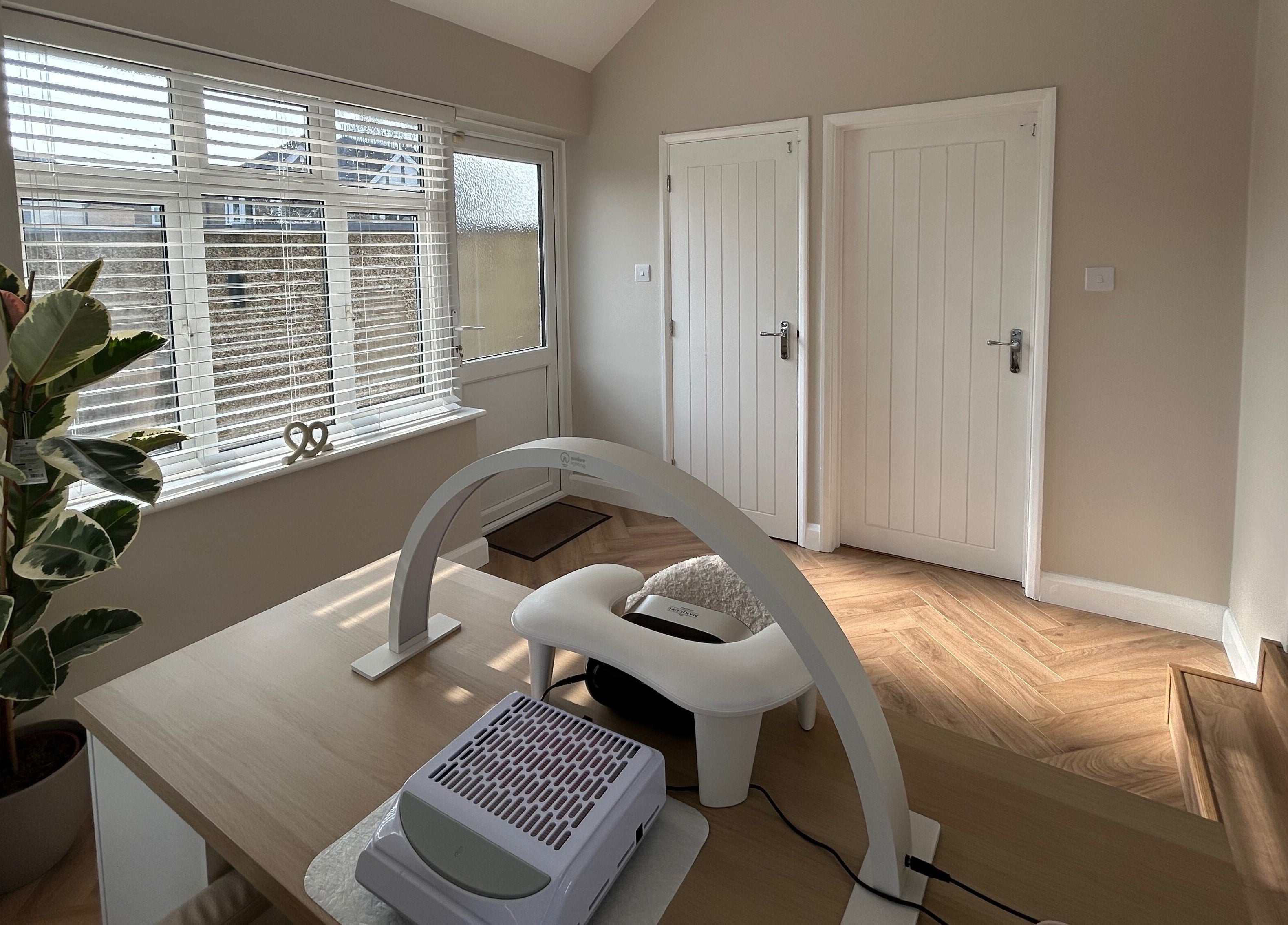 Bright interior of The Nail Room at Epsom Downs, Epsom, England, GB, highlighting modern nail care station.