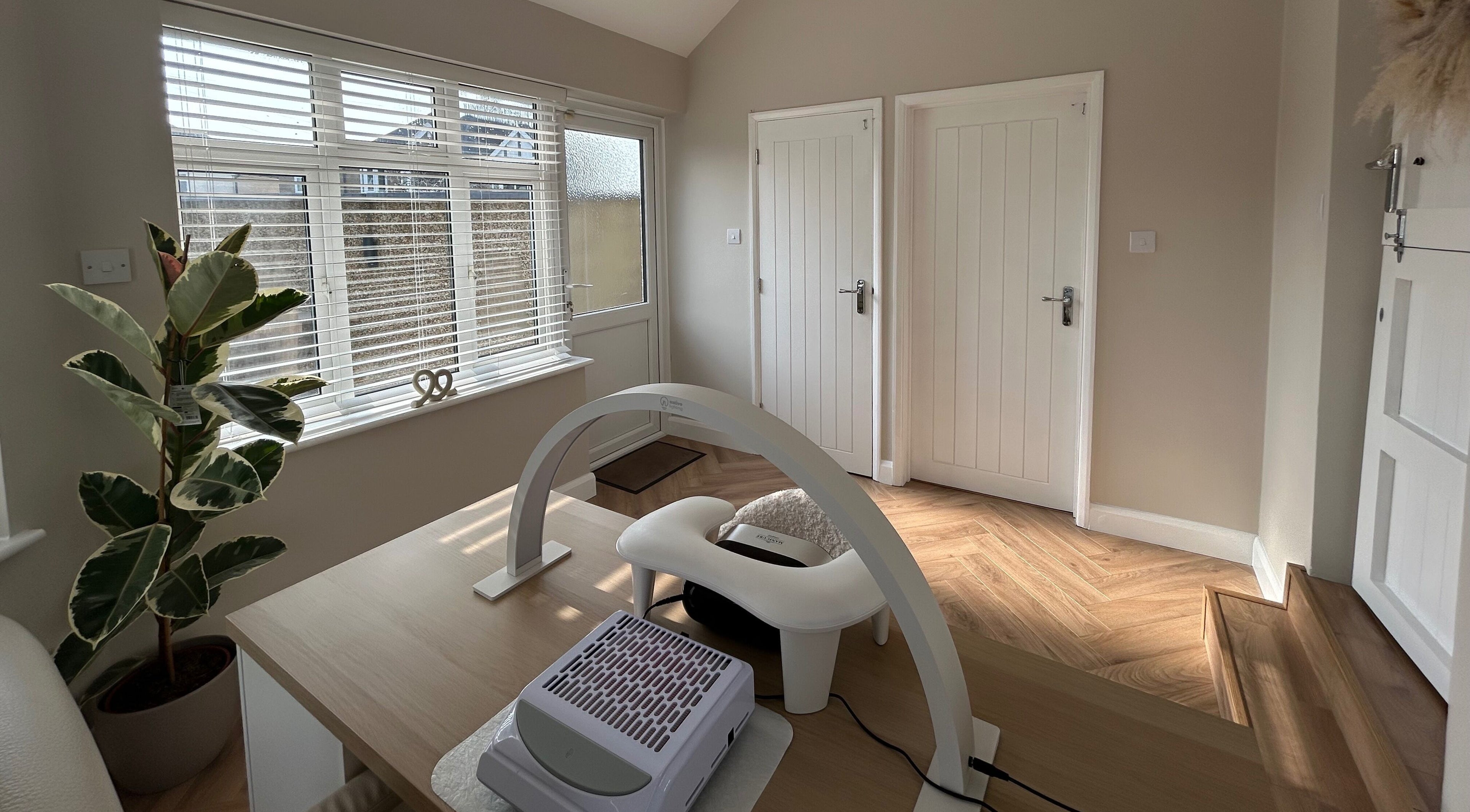 Bright interior of The Nail Room at Epsom Downs, Epsom, England, GB, highlighting modern nail care station.