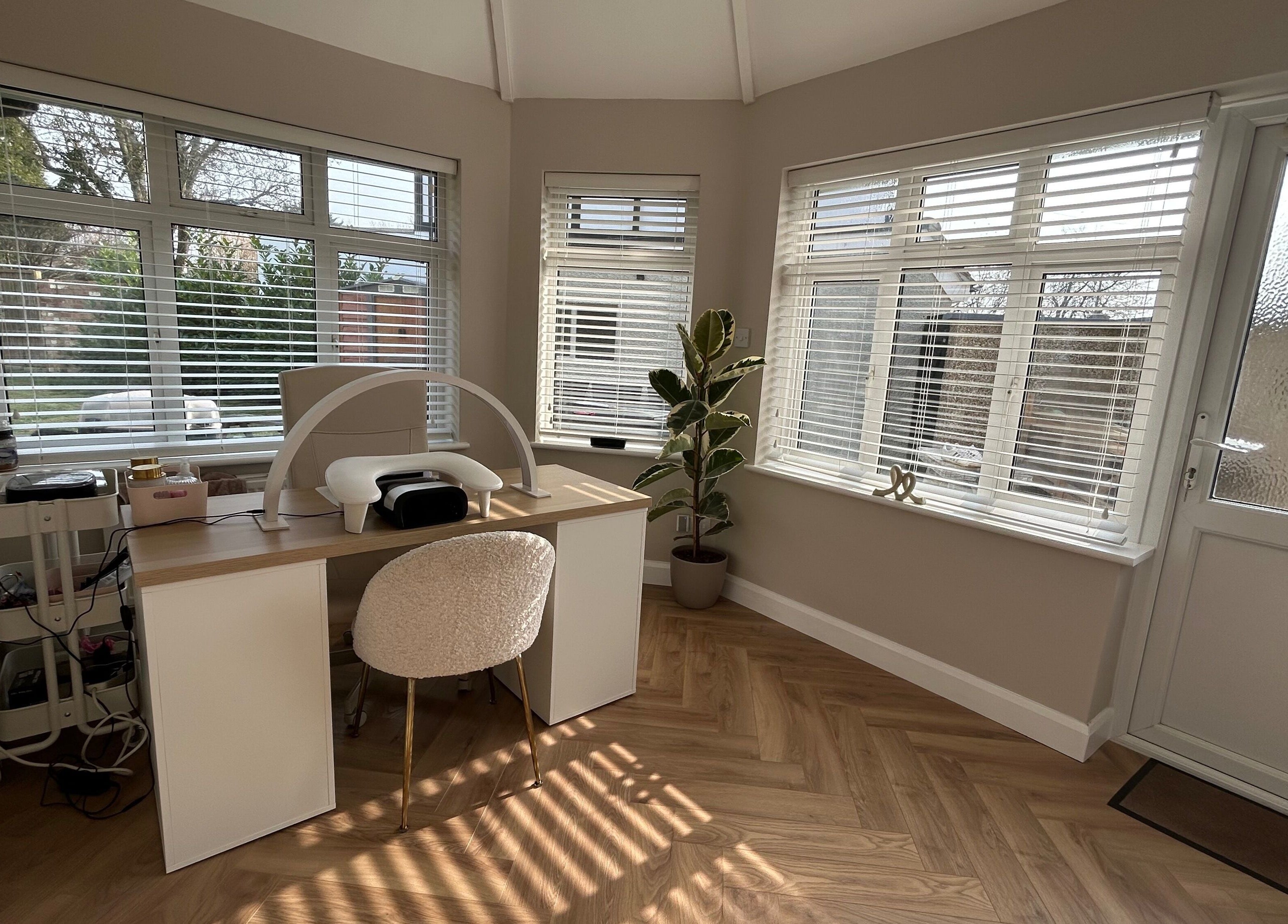 Cozy interior of The Nail Room at Epsom Downs in Epsom, England, GB with bright natural light and nail station.