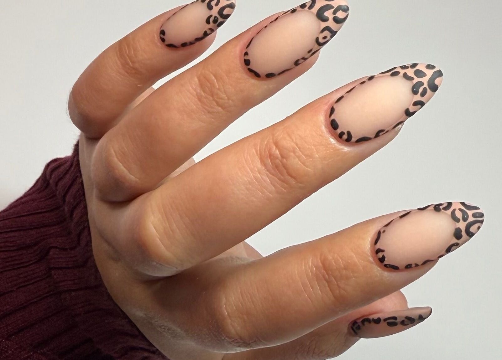 Chic leopard print nail art by MF Nail Artist, Rustenburg, North West, ZA. Stylish and creative manicure design.