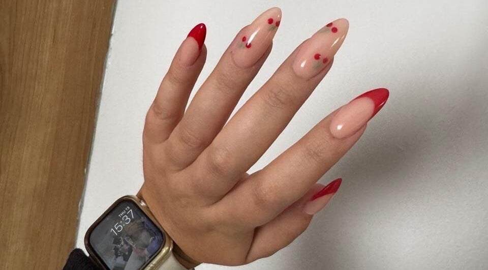 Elegant red-tipped nails designed by MF Nail Artist in Rustenburg, North West, ZA, exemplifying unique style.