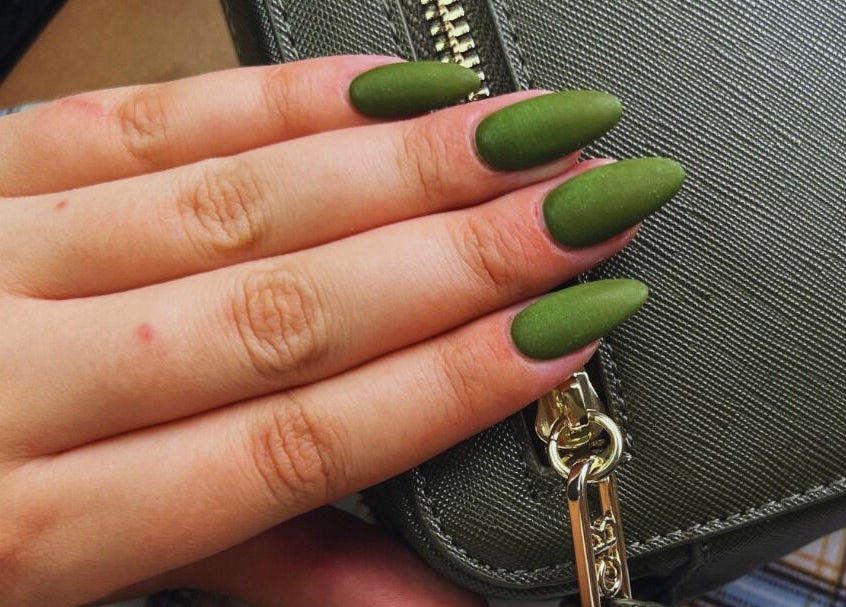 Stunning olive green nails by MF Nail Artist in Rustenburg, North West, ZA, elegantly holding a textured purse.