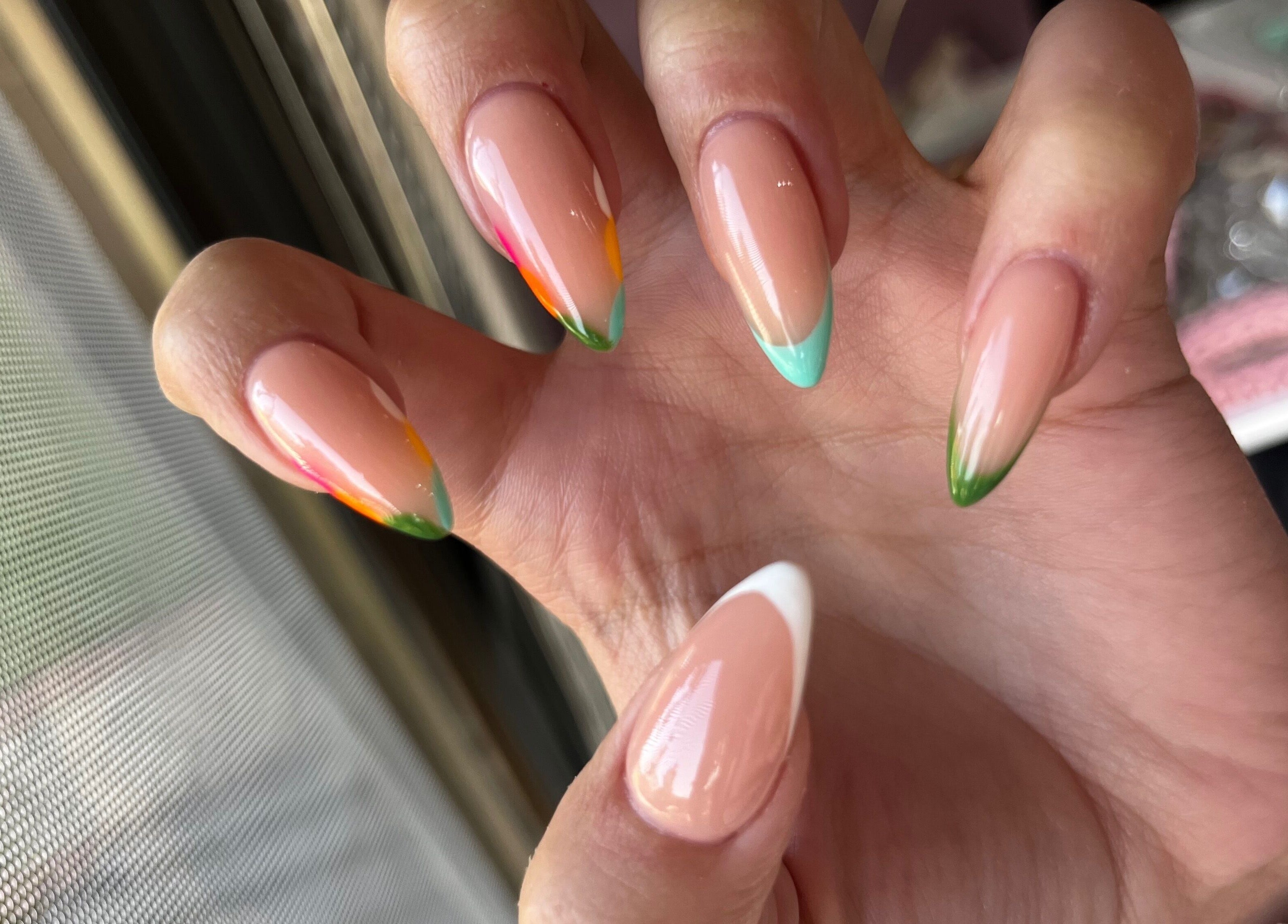 Colorful French manicure showcased at MF Nail Artist in Rustenburg, North West, ZA.