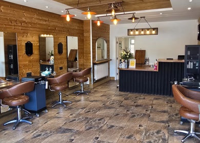 Stylish interior of Hype salon in Sheffield, England, GB with leather chairs and modern lighting.
