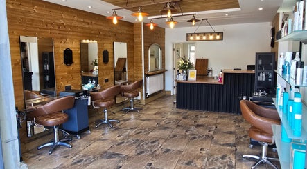Stylish interior of Hype salon in Sheffield, England, GB with leather chairs and modern lighting.