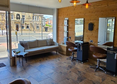 Cozy salon interior at Hype, Sheffield, England, GB, featuring stylish seating and elegant decor.