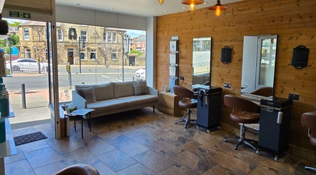 Cozy salon interior at Hype, Sheffield, England, GB, featuring stylish seating and elegant decor.