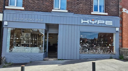 Exterior view of Hype beauty salon in Sheffield, England, GB with elegant signage and large glass windows.