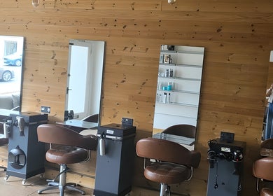Modern salon chairs and mirrors at Hype in Sheffield, England, GB. Stylish design enhances beauty experience.