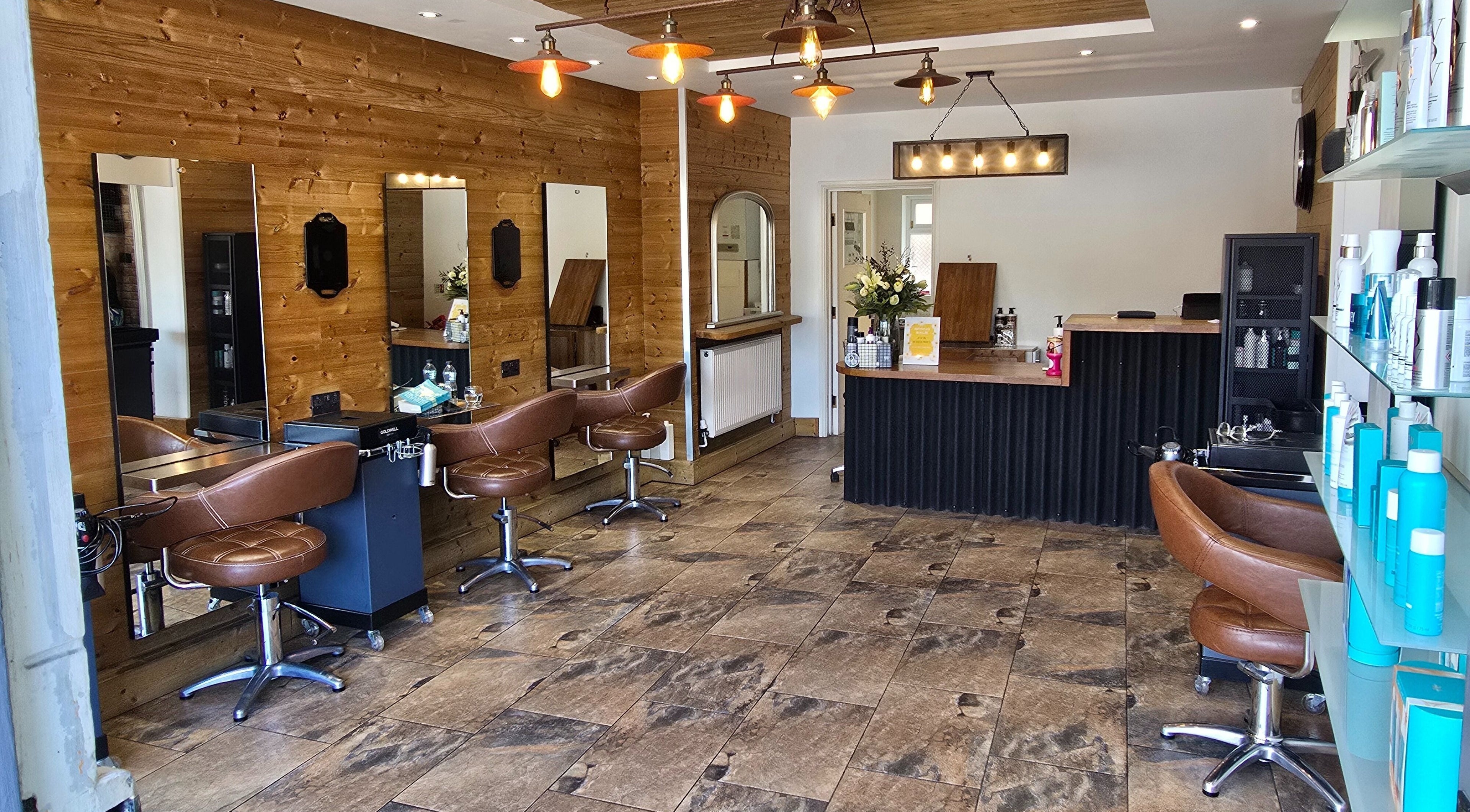 Modern salon interior at Hype Woodseats in Sheffield, England, GB featuring stylish chairs and mirrors.