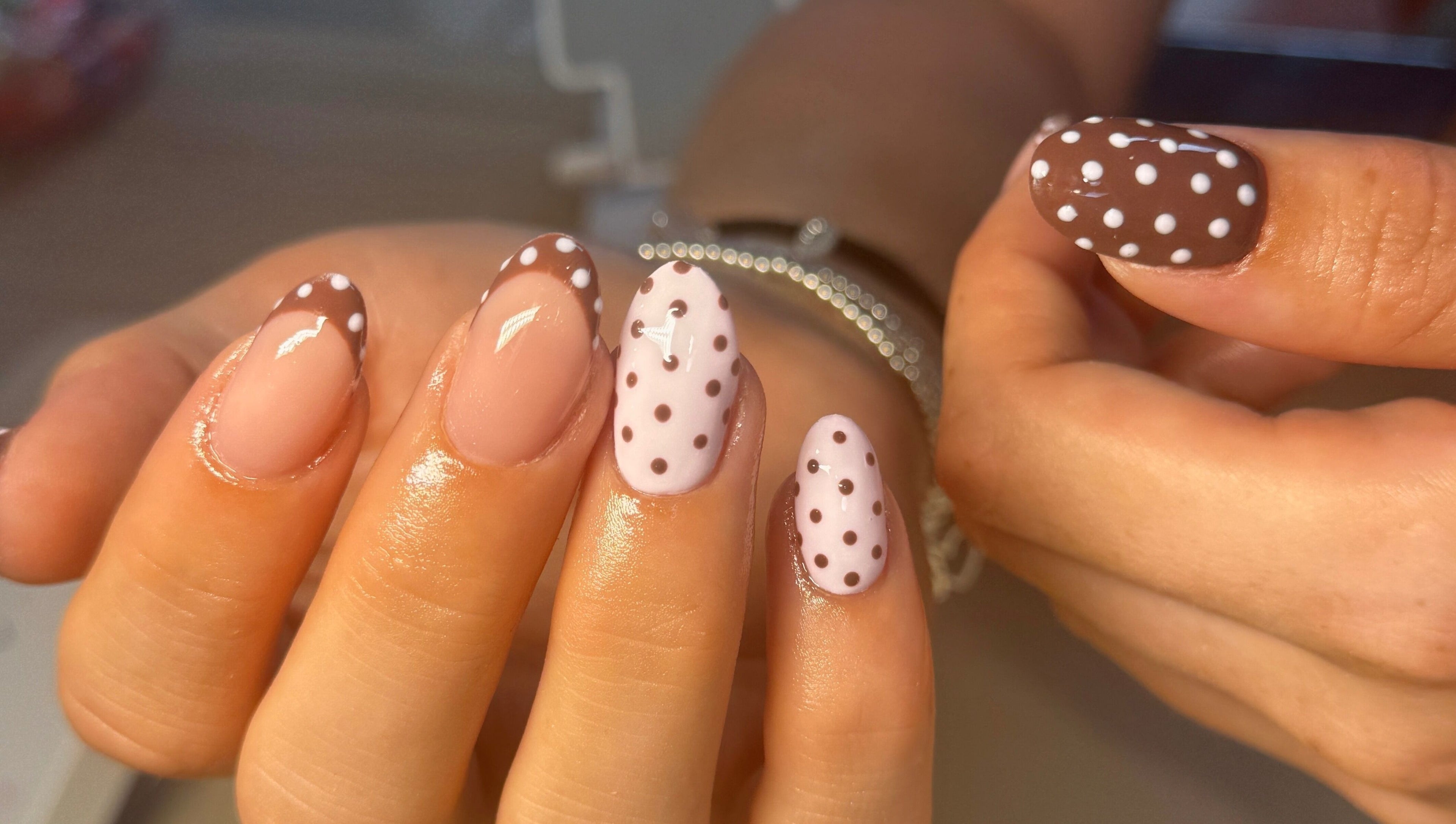 Elegant polka-dot nail art at Nailsby Georgia, Saint Helens, England, GB. Perfect for a chic look.