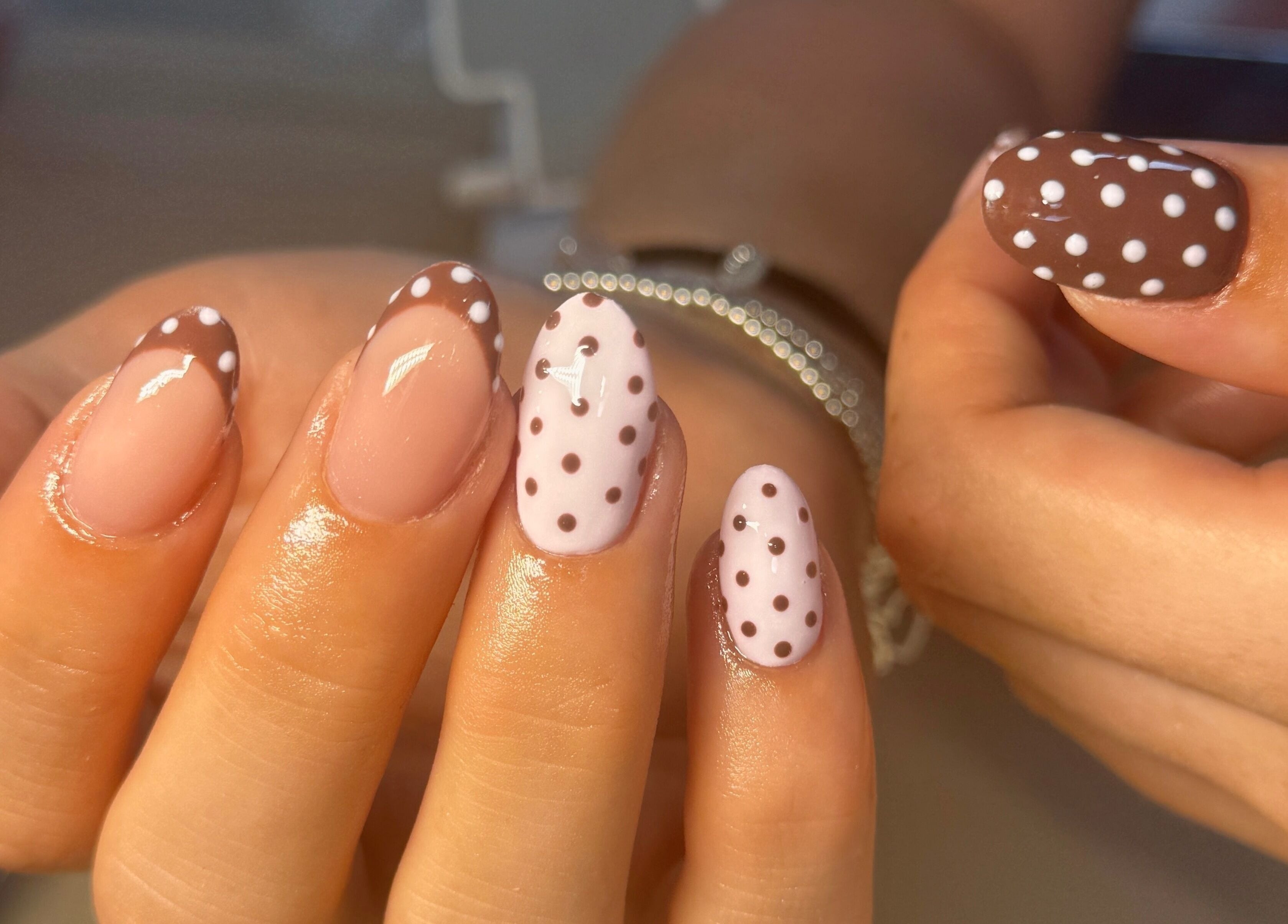 Elegant polka-dot nail art at Nailsby Georgia, Saint Helens, England, GB. Perfect for a chic look.