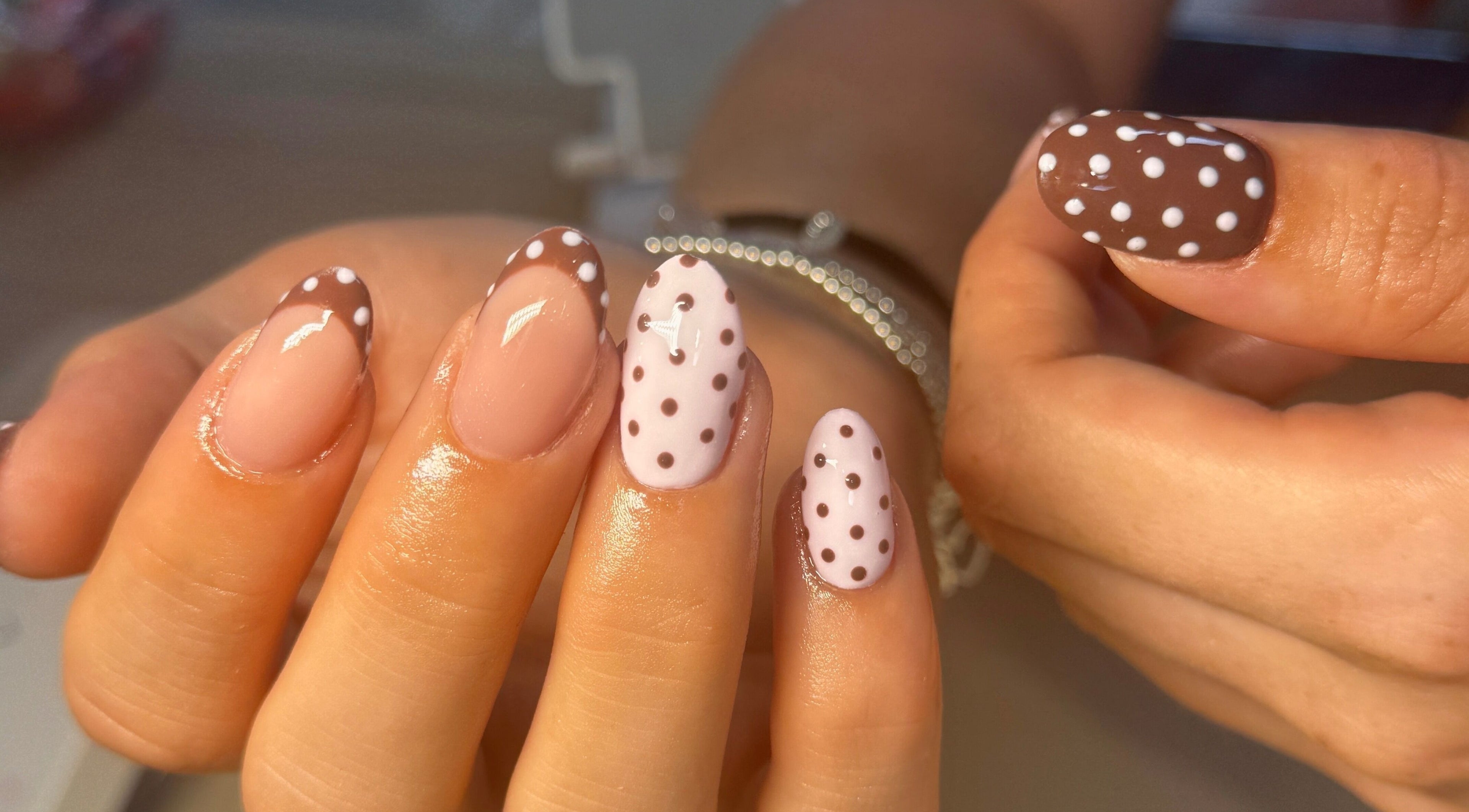 Elegant polka-dot nail art at Nailsby Georgia, Saint Helens, England, GB. Perfect for a chic look.
