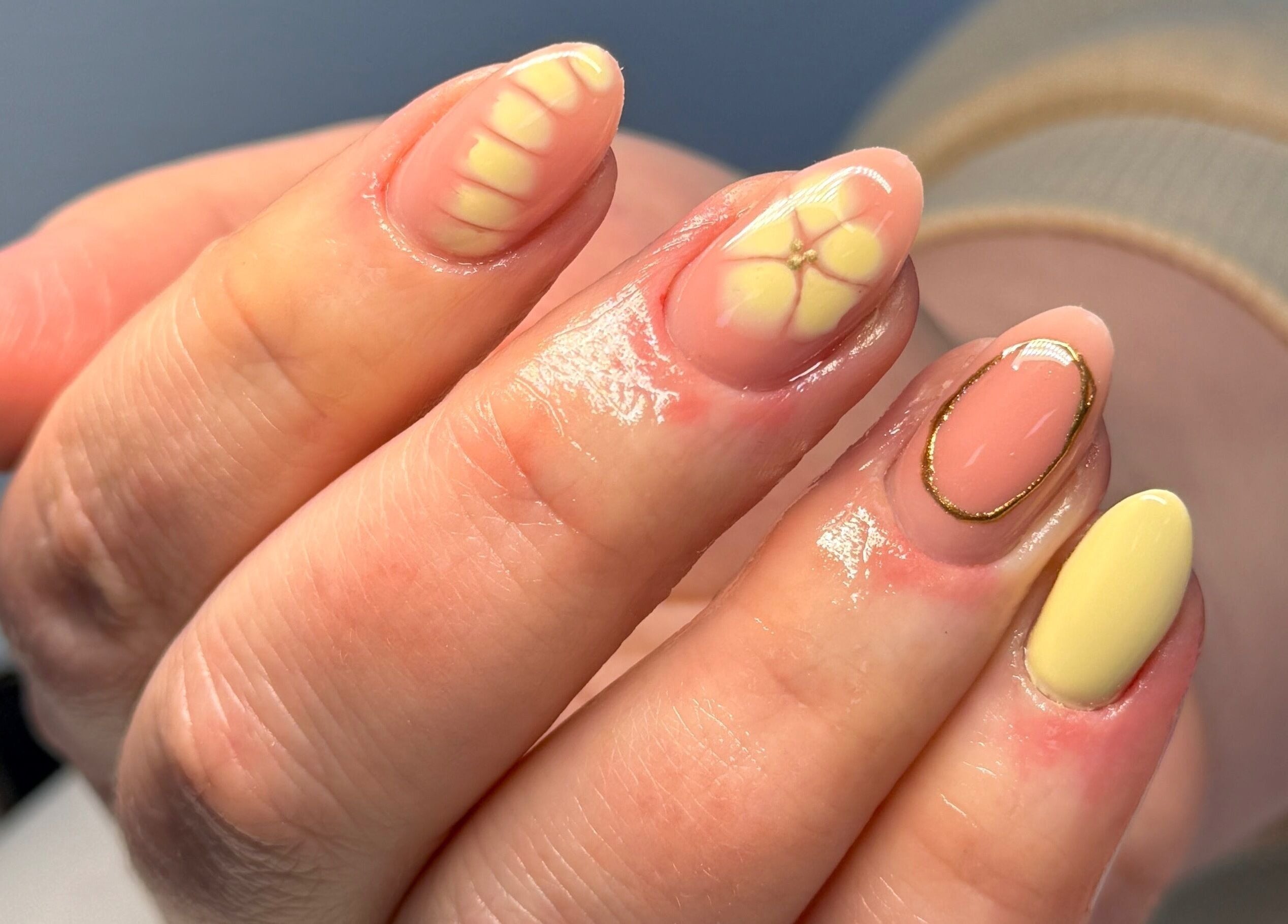 Stylish floral yellow and peach nail design at Nailsby Georgia in Saint Helens, England, GB.