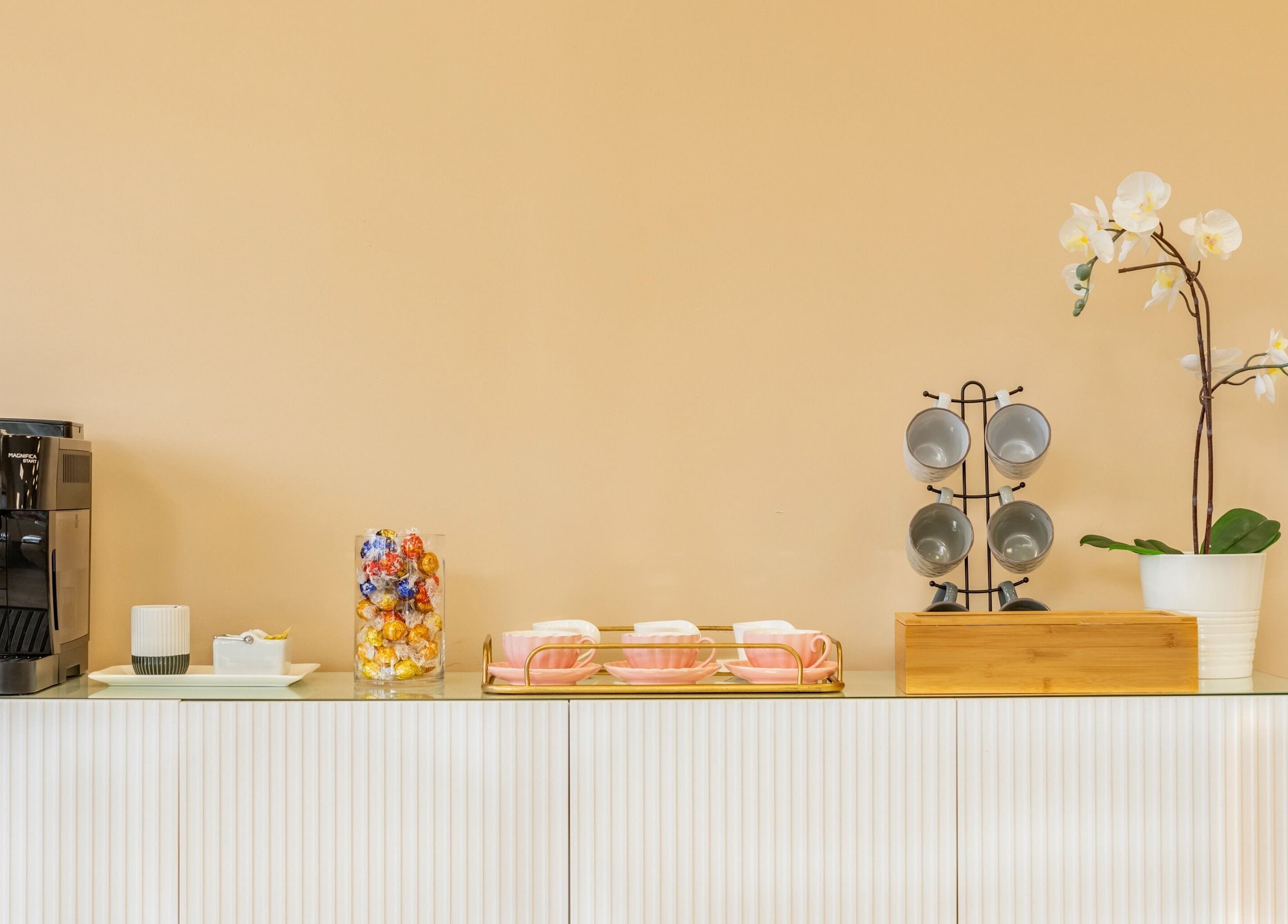 Elegant coffee station at Jacques Janine in Orlando, Florida, US, featuring modern decor and refreshments.