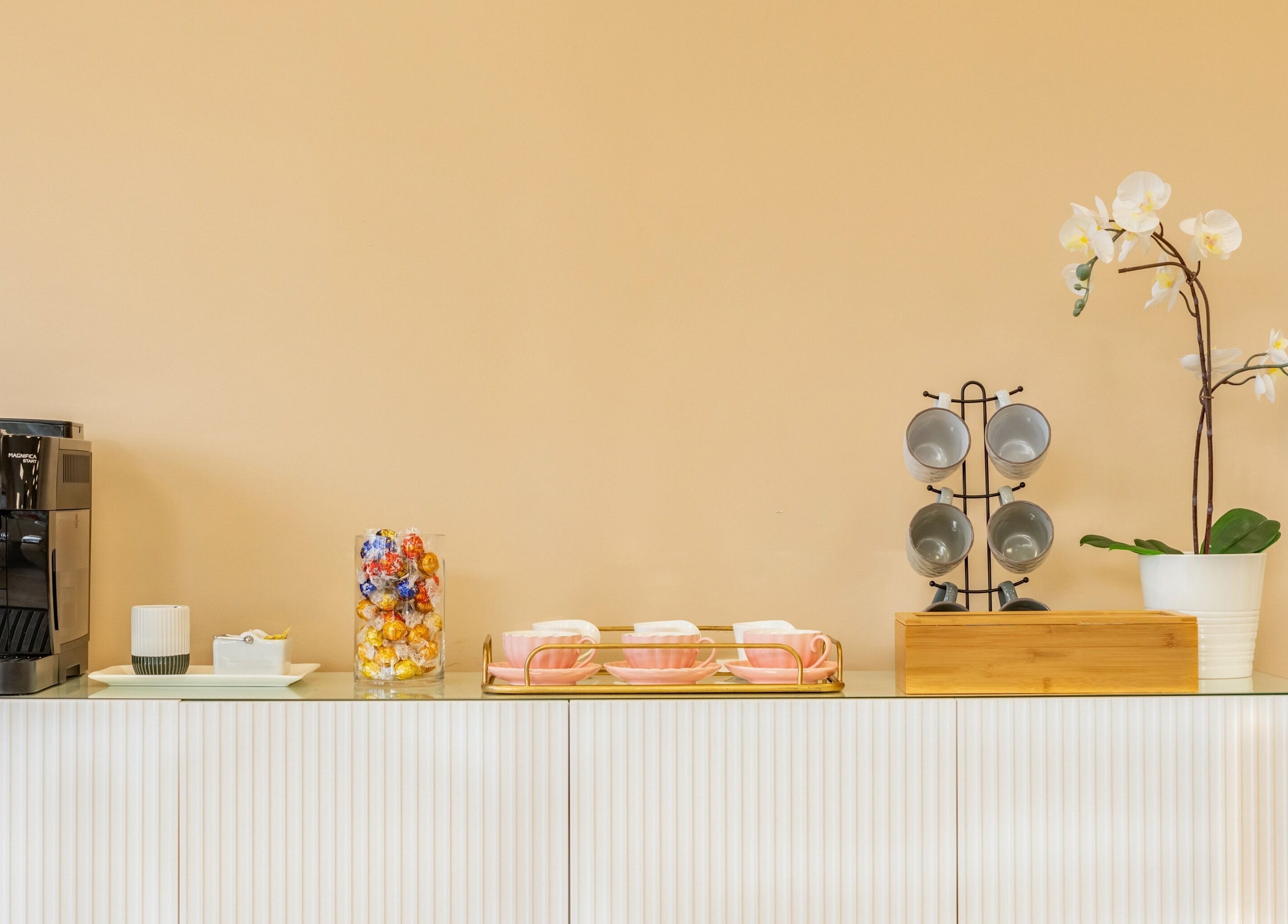 Elegant coffee station at Jacques Janine in Orlando, Florida, US, featuring modern decor and refreshments.