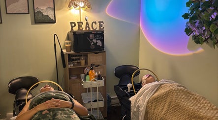 Tranquil spa setup at Lash + Headspa Suite, Fort Erie, Ontario, CA, featuring cozy beds and calming decor.