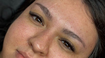 Close-up of a woman's face showcasing lush lashes at Lash + Headspa Suite, Fort Erie, Ontario, CA.