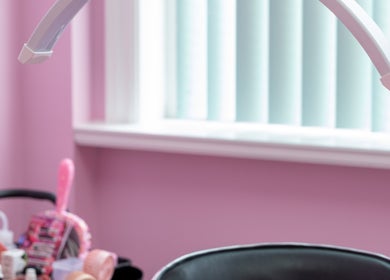 Pink-themed beauty station at Lash + Headspa Suite, Fort Erie, Ontario, CA, showcasing tools and decor.