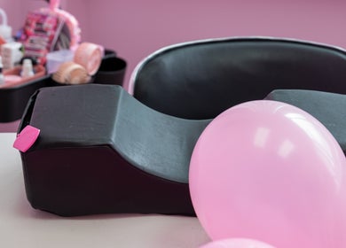 Comfortable beauty chair setup at Lash + Headspa Suite in Fort Erie, Ontario, CA with pink decor.