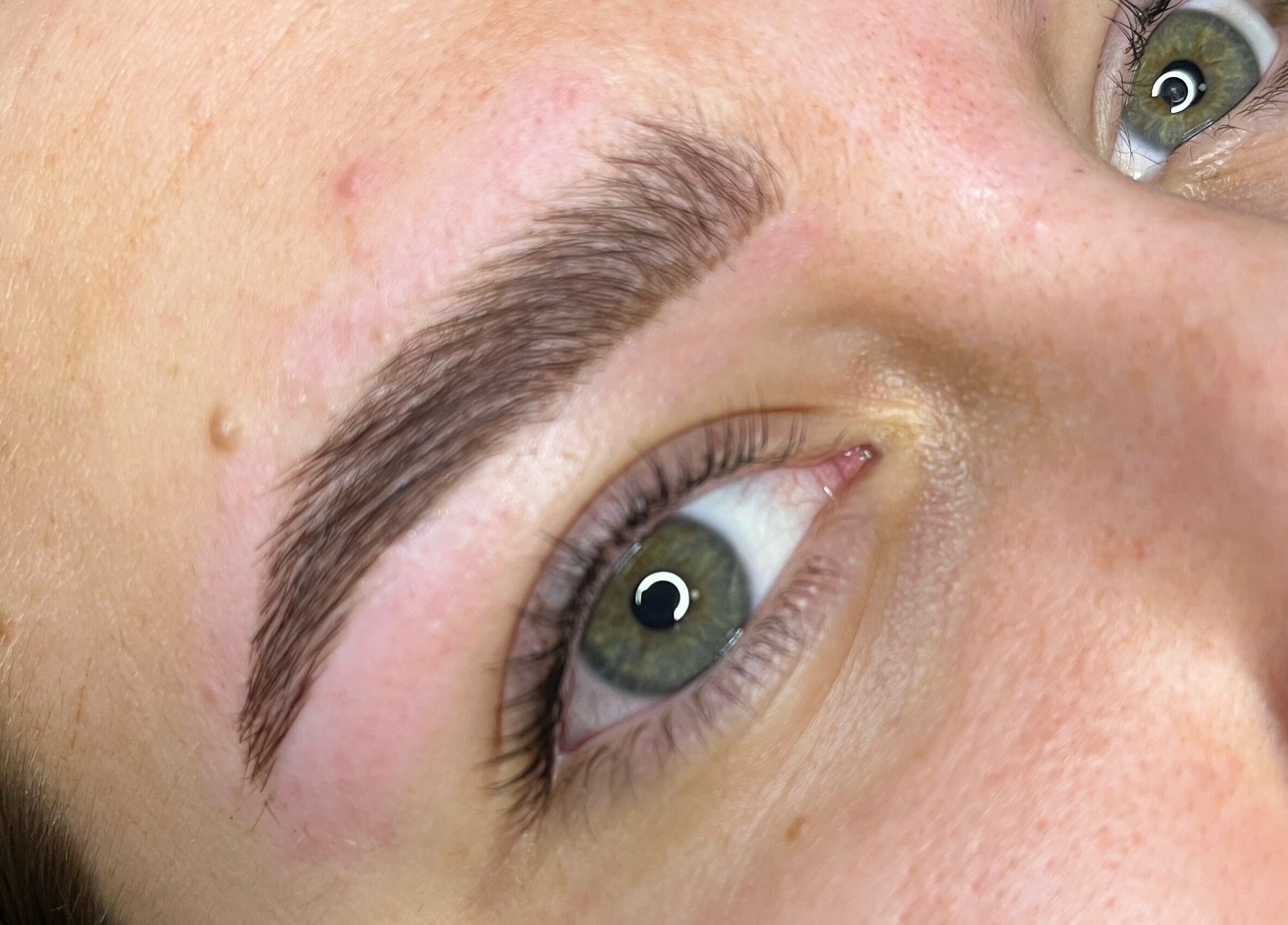 Close-up of perfectly shaped eyebrows at Cosmetics By Jess, Petersfield, England, GB.
