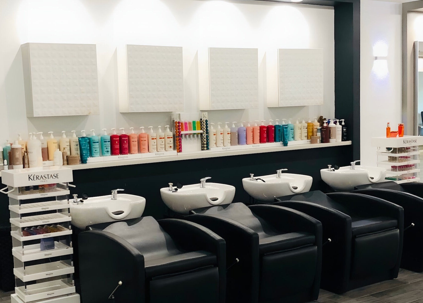 Sleek wash stations at Miva Salon - B Street, Hayward, California, US, showcasing luxury haircare products.