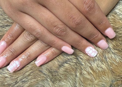 Beautifully manicured nails with pink polish at Nails By Emm, Duncan, South Carolina, US.