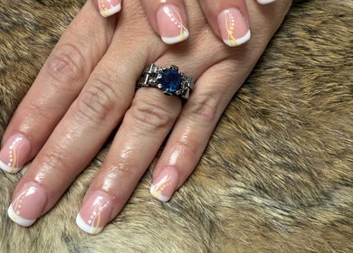 Stylish French nail art with elegant accents at Nails By Emm, Duncan, South Carolina, US.