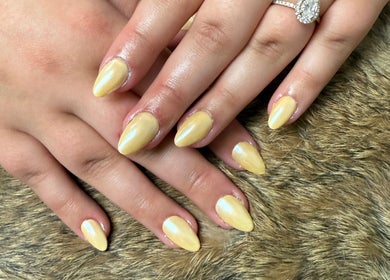 Elegant golden nails at Nails By Emm, Duncan, South Carolina, US. Perfect for a stylish and polished look.